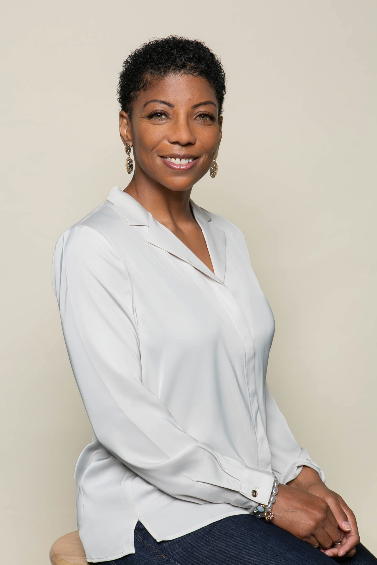 Portrait of Leslie Curtis in a soft white blouse